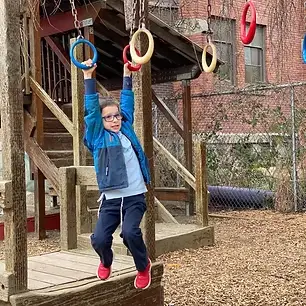 Boy on monkey bars