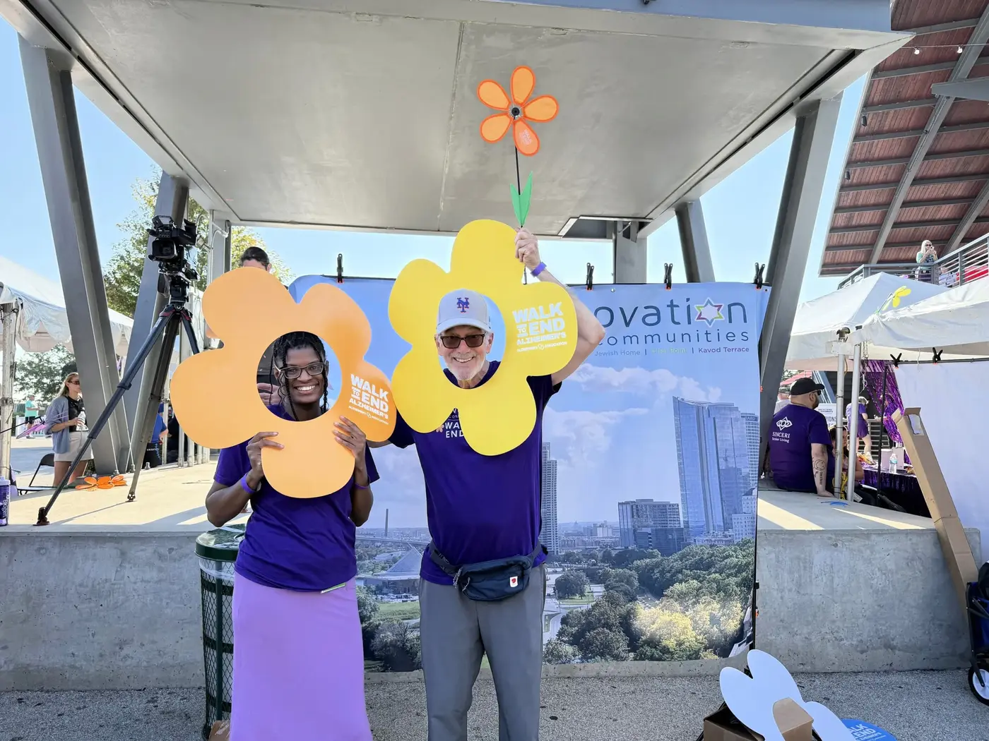 posing at the Ovation booth at ALZ Walk MKE