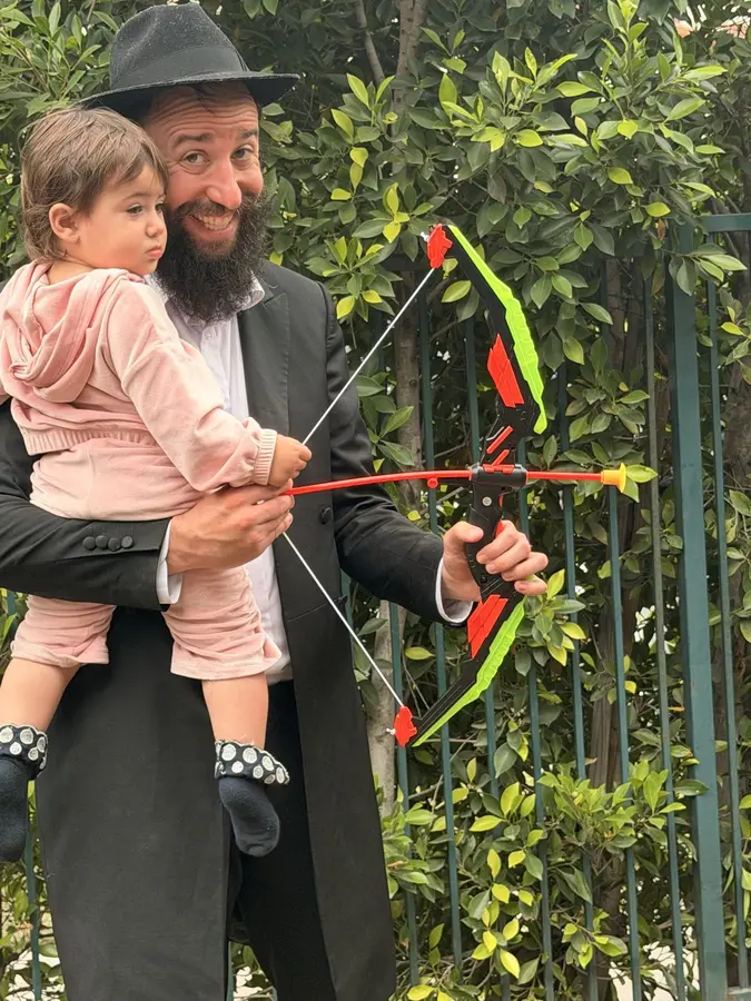 Children shaking the lulav at Sukkot