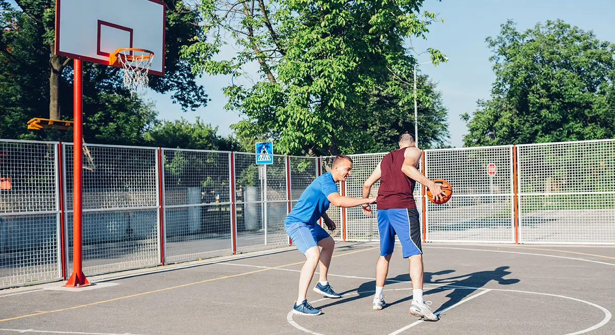 Men playing basketball